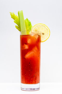 freshly made Bloody Mary cocktail or tomato juice, garnished with celery and lemon