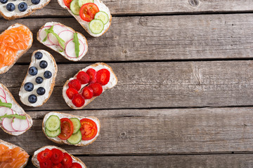 Variation of toast with fruit , vegetable and salmon