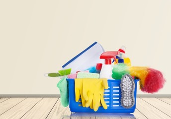 Plastic bottles, cleaning sponges and gloves  on background