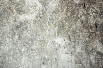 Cracked cement wall closeup for background. Old and cracked according to usage and weather conditions.