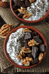 Chia yogurt, black chocolate and walnuts. Keto breakfast. Keto diet.