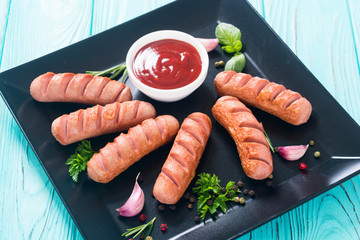 Fried sausages with herbs , spices and ketchup