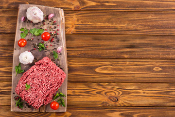 Raw minced beef meat with spices and herbs