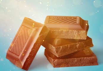 Delicious chocolates isolated on background