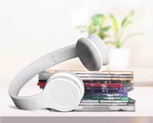 Headphones and compact discs  isolated   on background
