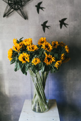 Bouquet of yellow small sunflowers close up