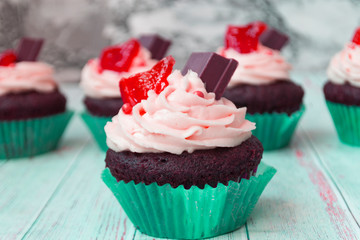 Chocolate cupcakes with vanilla butter frosting and golden crumbs, chocolate, and lemon. There is a memo for the text.