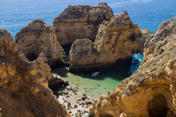 Naklejka na ściany i meble Algarve coast, Lagos sea and rocks in Portugal