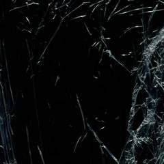 Transparent plastic wrap on the black background. Plastic bag texture. Reusable trash and waste.