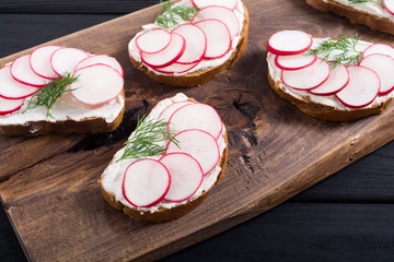 Healthy vegetable toasts sandwith with radish and dill