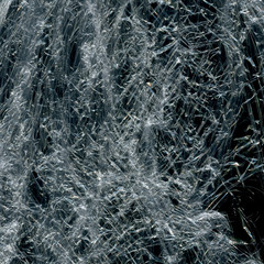 Transparent plastic wrap on the black background. Plastic bag texture. Reusable trash and waste.
