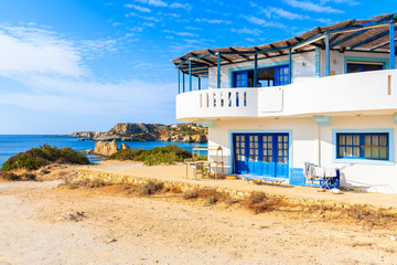 White Greek taverna on sea coast of Karpathos island, Greece