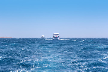 Boat Wave ocean trace on blue sea fresh water background.
