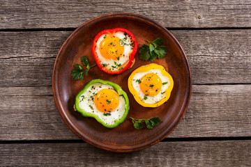 Yellow , red and green pepper with fried eggs