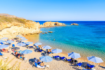 KARPATHOS ISLAND, GREECE - SEP 26, 2018: People relaxing on beautiful beach on Karpathos island...