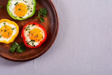 Yellow , red and green pepper with fried eggs