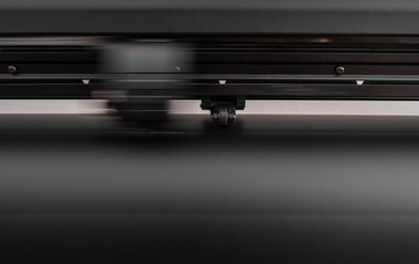 Obraz premium Vinyl cutter plotter machine and moving cutting head