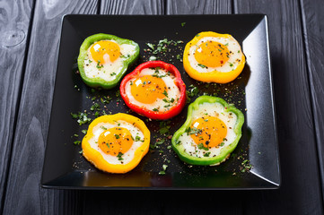 Yellow , red and green pepper with fried eggs