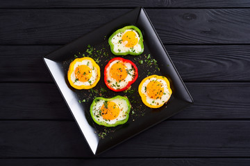 Yellow , red and green pepper with fried eggs