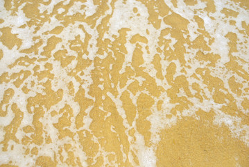 Soft wave of blue ocean on sandy beach. Background