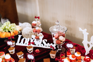 decoration and inscription on wedding candy bar. macaroons in va