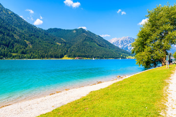 Fototapeta premium Beach at beautiful Achensee lake on sunny summer day, Tirol, Austria