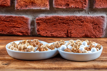 Roasted chickpeas in white cup on hardwood.The Turkish name is leblebi.