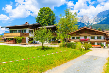 Obraz premium Traditional alpine houses in village of Going am Wilden Kaiser on beautiful sunny summer day, Tirol, Austria