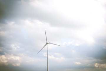 Obraz premium Sustainable energy production from natural renewable resources. Wind farms and turbines
