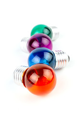 Group of Multiple color Incandescent round light bulb isolated on white background.