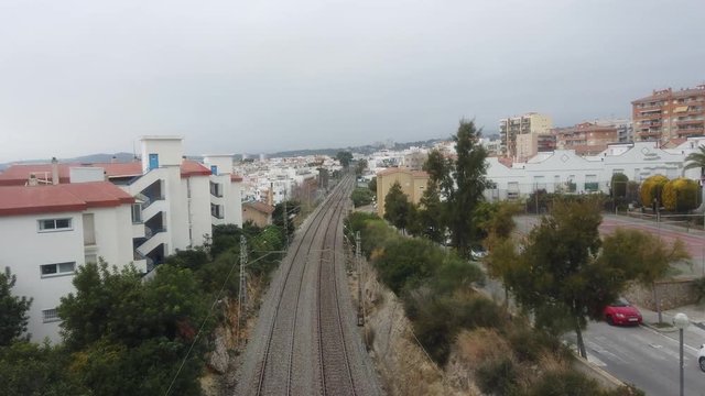 Aerial view of train  railway track in  Sitges. Barcelona. 4k Drone Video