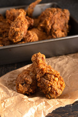 Batch of Crispy Homemade Fried Chicken on a Rustic Wooden Table