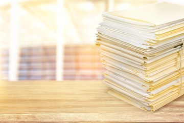 Stack of documents in folders isolated on white