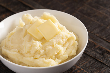 Mashed Potatoes with Butter on a Wooden Table