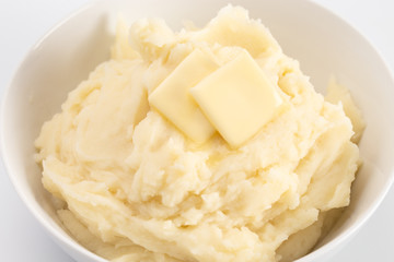 Potatoes with Butter Isolated on a Wooden Table