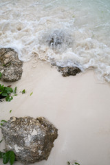 Rocks and waves in the beach
