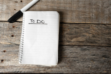 To do list blank  written with black marker on  notebook
