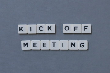 ' Kick Off Meeting ' word made of square letter word on grey background.
