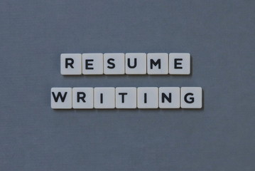 ' Resume Writing ' word made of square letter word on grey background.