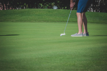 Obraz premium Man golfing at country club