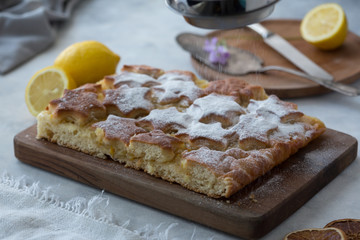 Piece of lemon pie for a breakfast. Piece of lemon pie for a breakfast on a light background