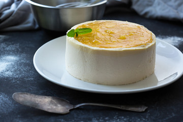 Mango fruit Mousse Cake, decorated with fresh fruits in jelly. Whipped cheese with biscuits