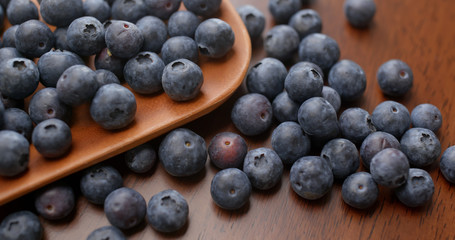 Stack of blueberry on the wooden plate