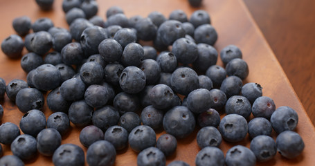 Stack of blueberry on the wooden plate