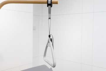Hospital bed triangle handle with emergency remote control beacon. Accessories in retirement home...