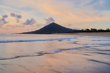 Beach of moledo at the end of the day, with a view to trega mountain on spanish side of the border. Low tide displaying the sandy beach on a cloudy day.