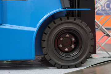 Naklejka na ściany i meble The front wheels of the forklift