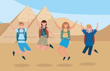 Fototapeta premium women and men jumping with backpack and camera