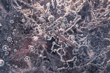 Texture abstract closeup background ice with grooves, furrows, and bubbles of air cought by frost...