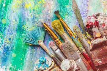 Row of artist paint brushes  on background